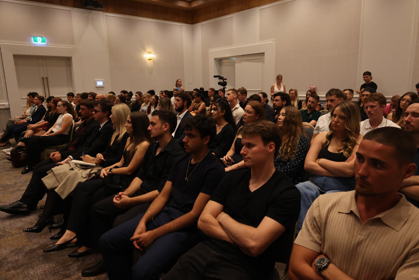 Attendees seated and listening at a Gold Coast event